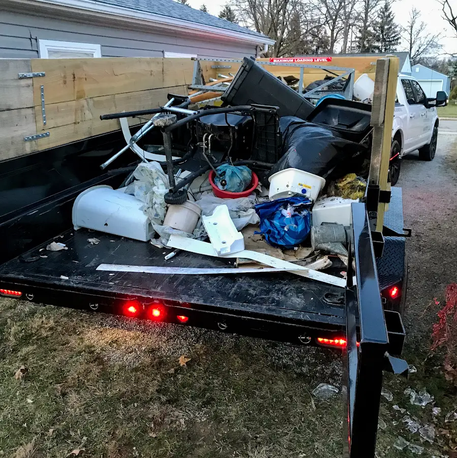 Roll-off dumpster delivered to a residential driveway in Mount Hope